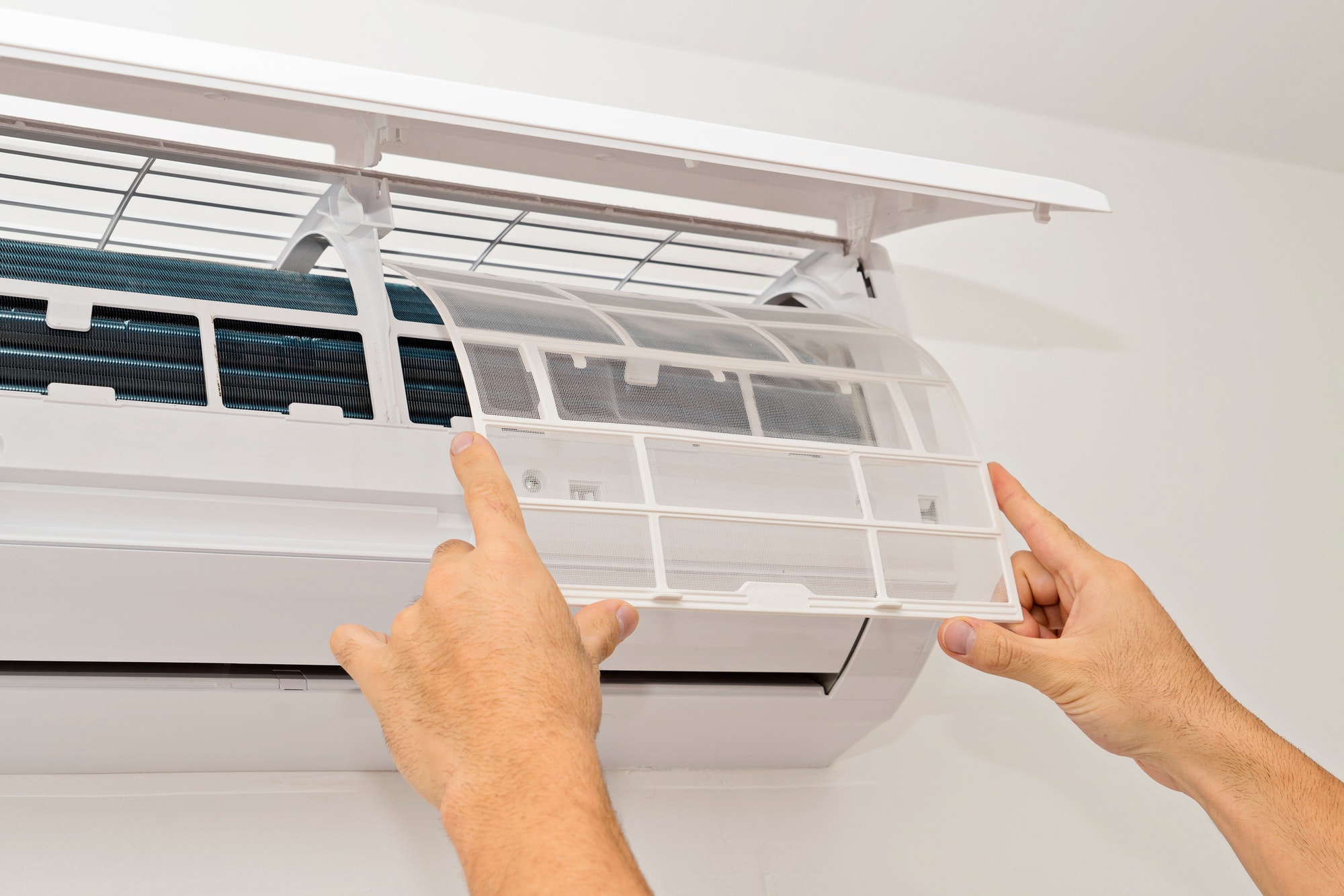 changing-the-filter-of-the-air-conditioner.jpg